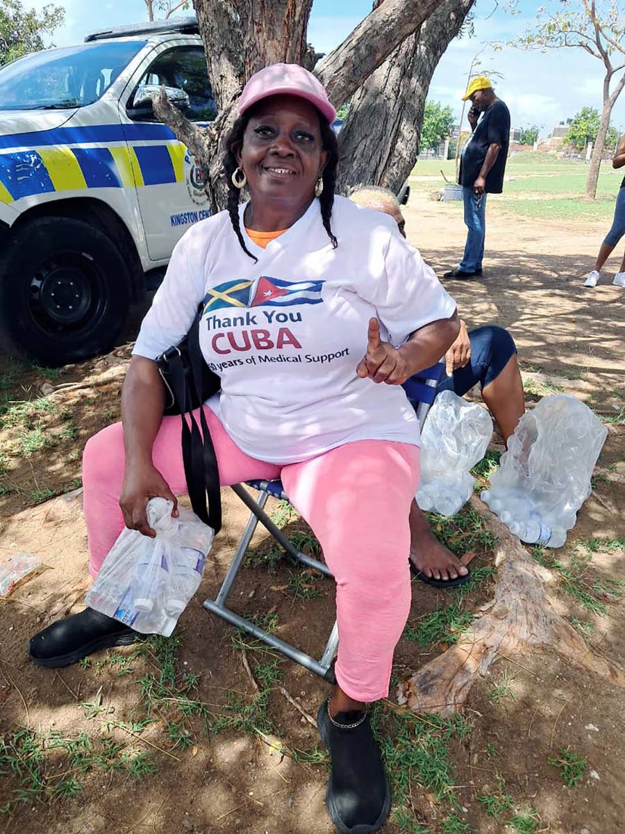 Joy British, a supporter of Cuban medical workers, takes a break during the Gratitude Walk. 