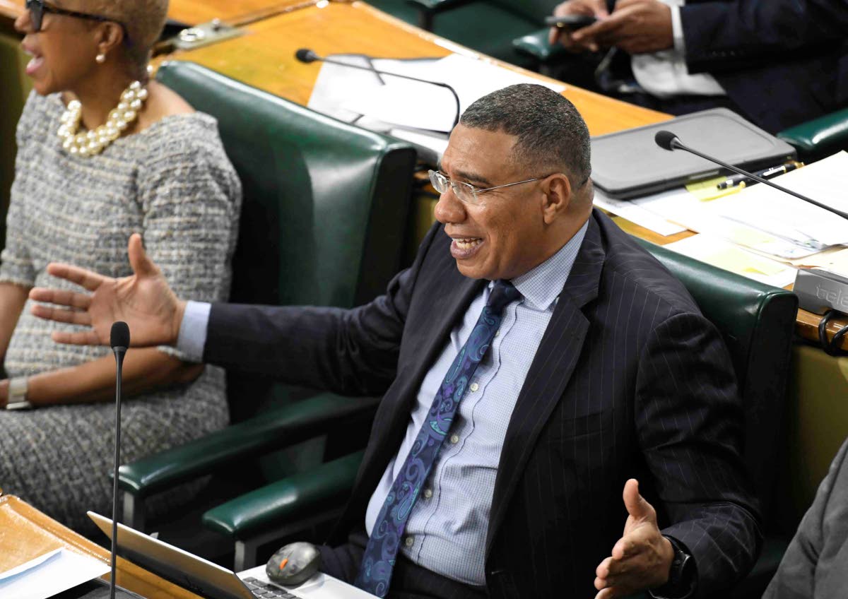 Prime Minister Dr Andrew Holness reacts as Opposition Leader Mark Golding makes his contribution to the 2026-2027 Budget Debate.