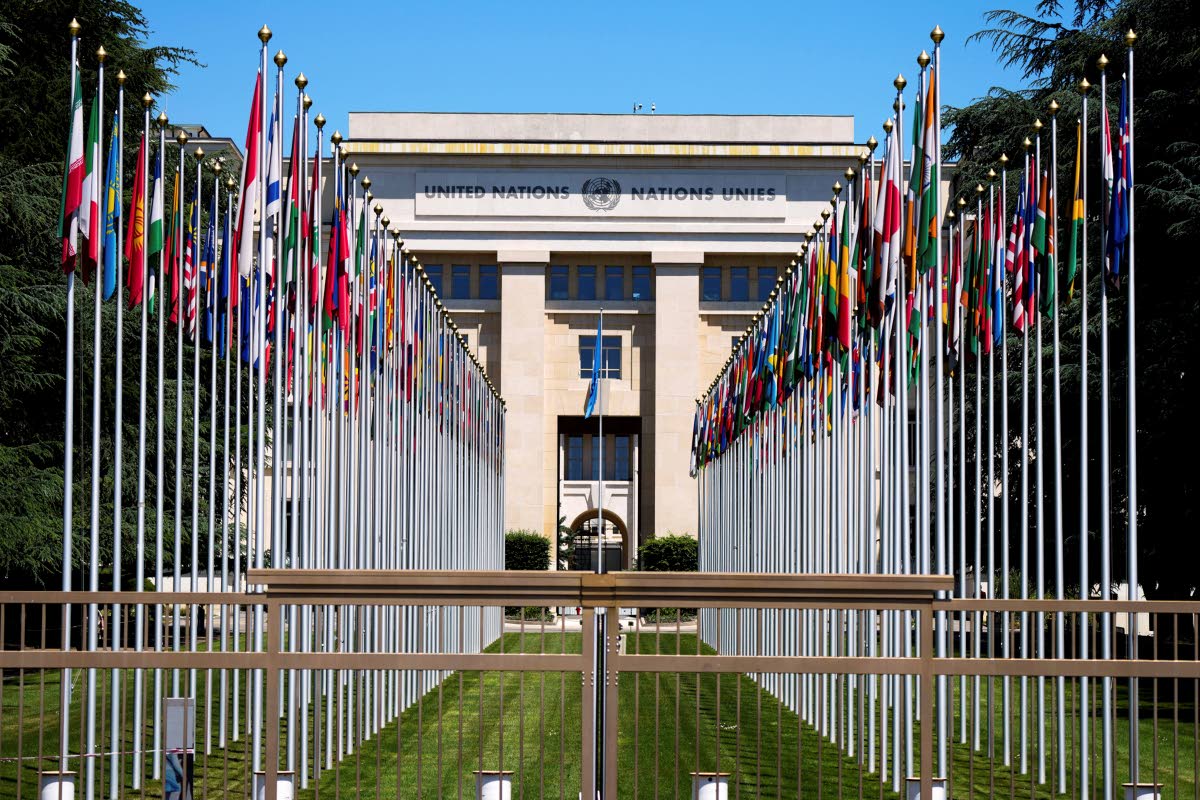FILE - Flagpoles line in rows in front of a building of the United Nations in Geneva, Switzerland, June 14, 2021. 