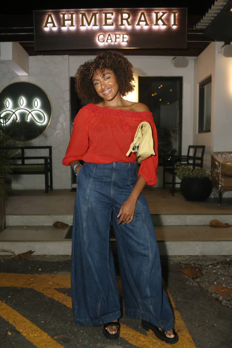 Stylist Ivy Coco Maurice poses at the entrance of Ahmeraki Café for Trendzy by Ackeilia’s Island in Bloom showcase at Rhythm Sundays.