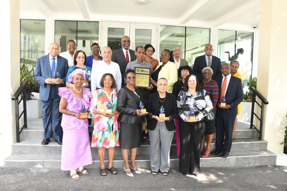 Recipients take a group photo with Earl Jarrett (fourth left, back row), chief executive officer of The Jamaica National Group; Parris Lyew-Ayee (third left, second row), chairman of the JN Foundation; Claudine Allen (third right), general manager of the J