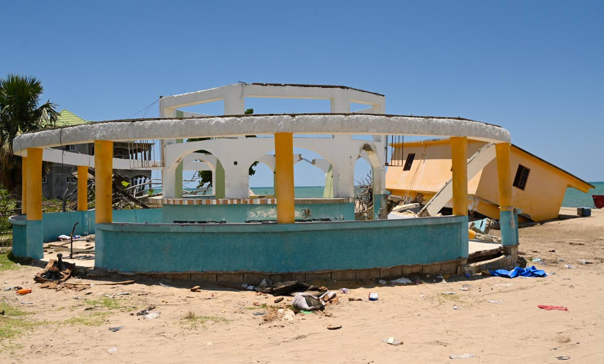 Basil Bennett’s bar that was destroyed during the passage during the passage of Hurricane Melissa almost six months ago. His sea-ravaged home can be seen in the background.