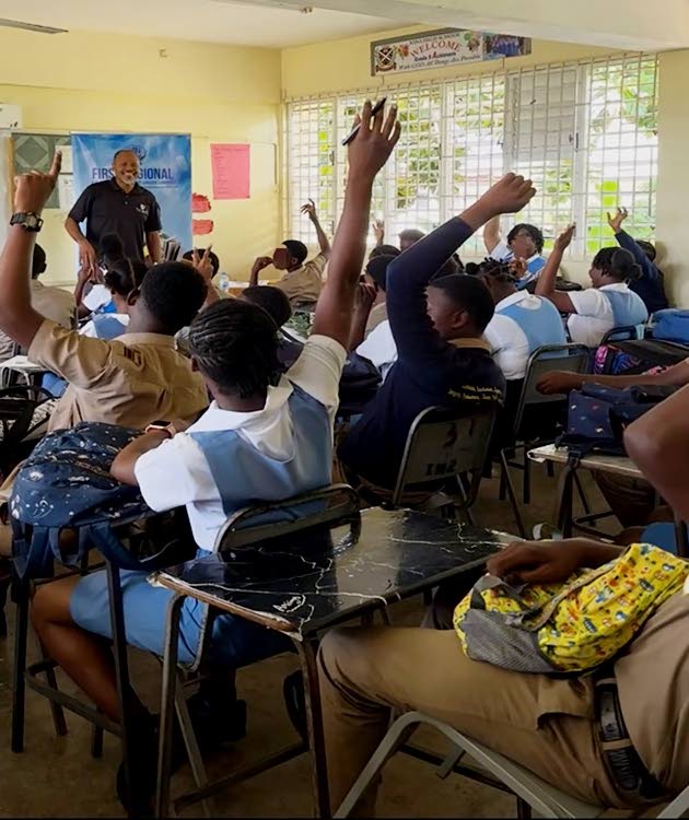 Deslon Brown, business development manager, First Regional Co-op Credit Union Ltd, presenting on financial literacy to grade-nine students at Iona High School in Tower Isle, St Mary, on Tuesday, April 21.