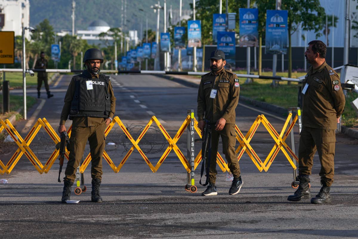 Police officers stand guard at a checkpoint near Serena Hotel, a possible venue for US and Iran talks, in Islamabad, Pakistan, on Saturday, April 25, 2026.