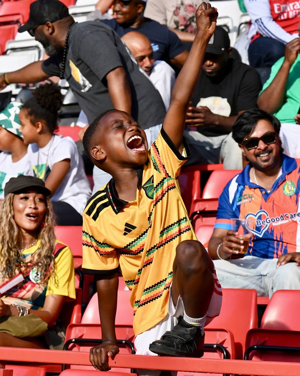 A fan of Team Jamaica makes sure they feel the love.