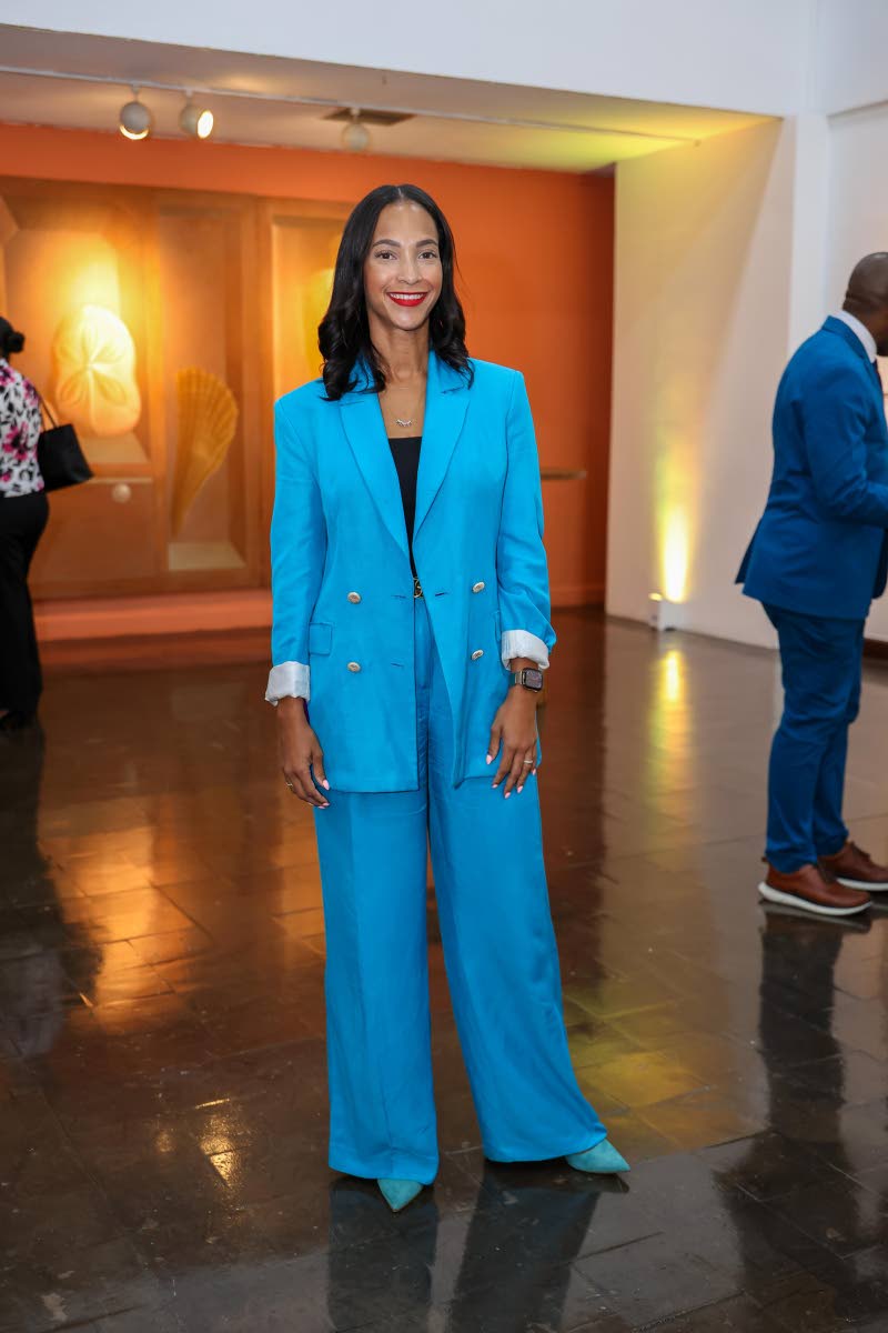 Melanie Levy, CEO of Kandy Kraze, opts for a blue pantsuit cut in a relaxed power-suit silhouette.