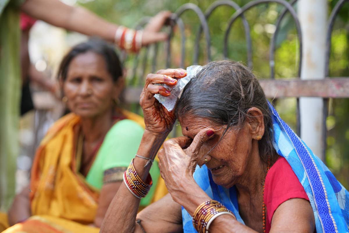A woman cools herself off with an ice pack during a heat wave in Banda, northern Indian state of Uttar Pradesh.