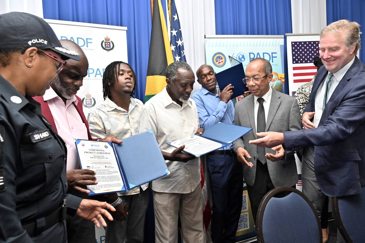 Dr Horace Chang (second right), deputy prime minister and minister of national security and peace; Scott Renner (right), charge d’affairs at the United State Embassy in Kingston; and Charmaine Shand (left), assistant commissioner of police, Community Saf