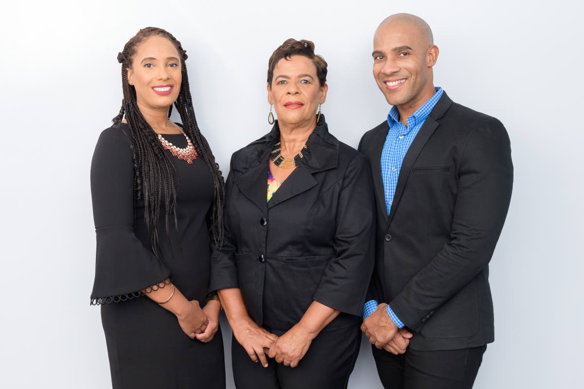 Family matriarch Eulie Mantock (centre) is flanked by her daughter Philone, a director of Mantock’s Guide, and her chief executive officer son, Clava.