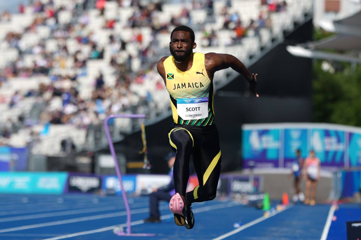 Jamaica’s Jordan Scott competes in the men’s triple jump final at the Commonwealth Games in Glasgow, Scotland, yesterday.