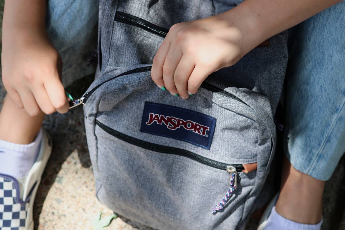 Choosing a backpack with two padded shoulder straps, multiple compartments and a waist or chest strap can help distribute weight more evenly and make carrying school supplies safer and more comfortable.