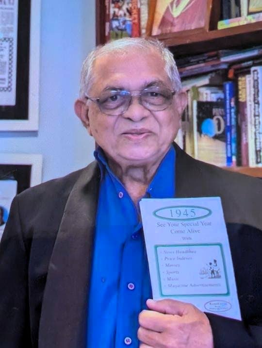 Tony Deyal with a copy of 1945 Nostalgia News