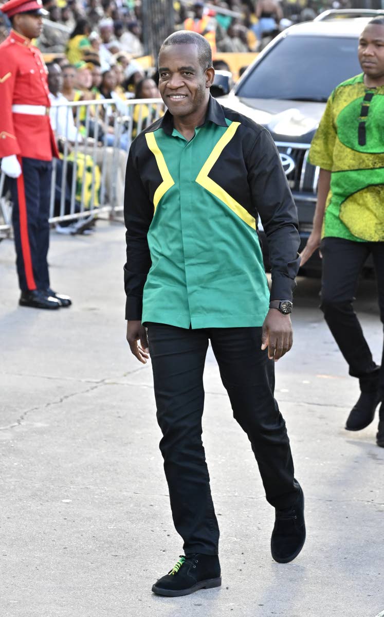 Dr Kevin Blake, commissioner of police, wears a Jamaican-flag button-down shirt with black trousers.