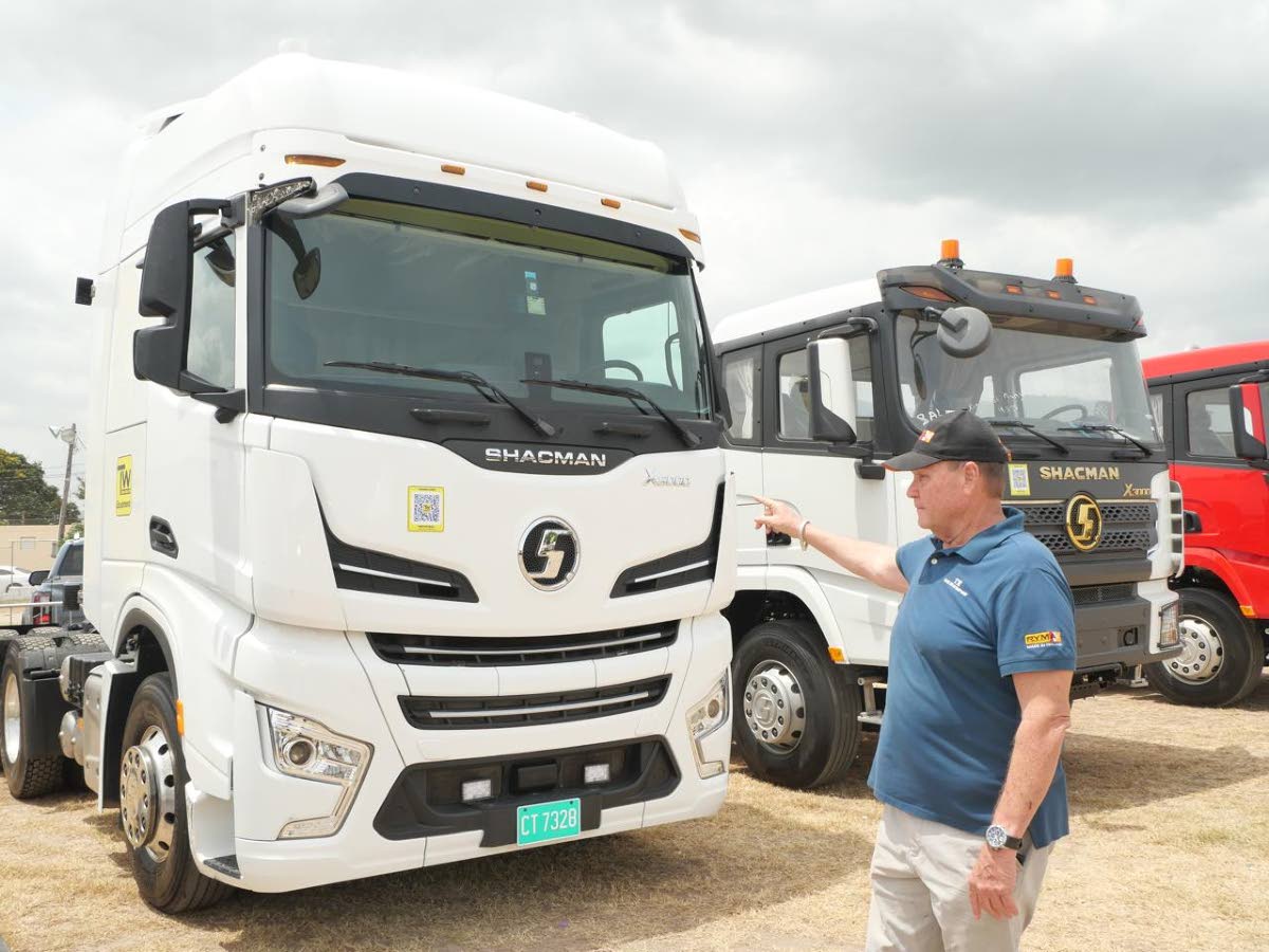 John Ralston, managing director of Tank-Weld Equipment, points to trucks used for training at the Tank-Weld HEART Trucking Academy.
