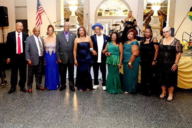 Ricardo ‘Rick’ Nugent (left), president and CEO of the Jamaican Association of Maryland (JAM), joins members of the association’s board of directors for a photograph during JAM’s Independence Gala.