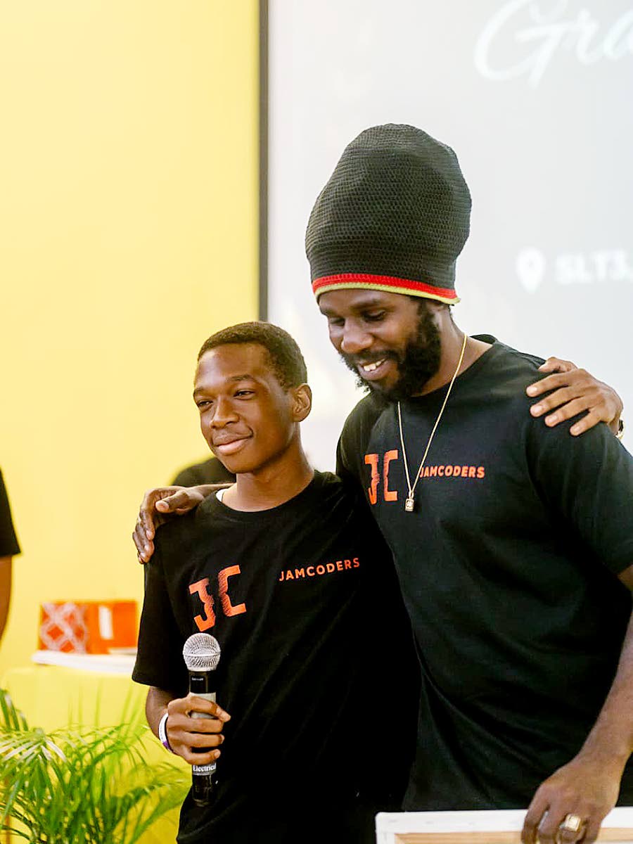 El-Nathan Pitkin shares a moment with Chronixx, co-founder and conceptualiser of the JamCoders programme.