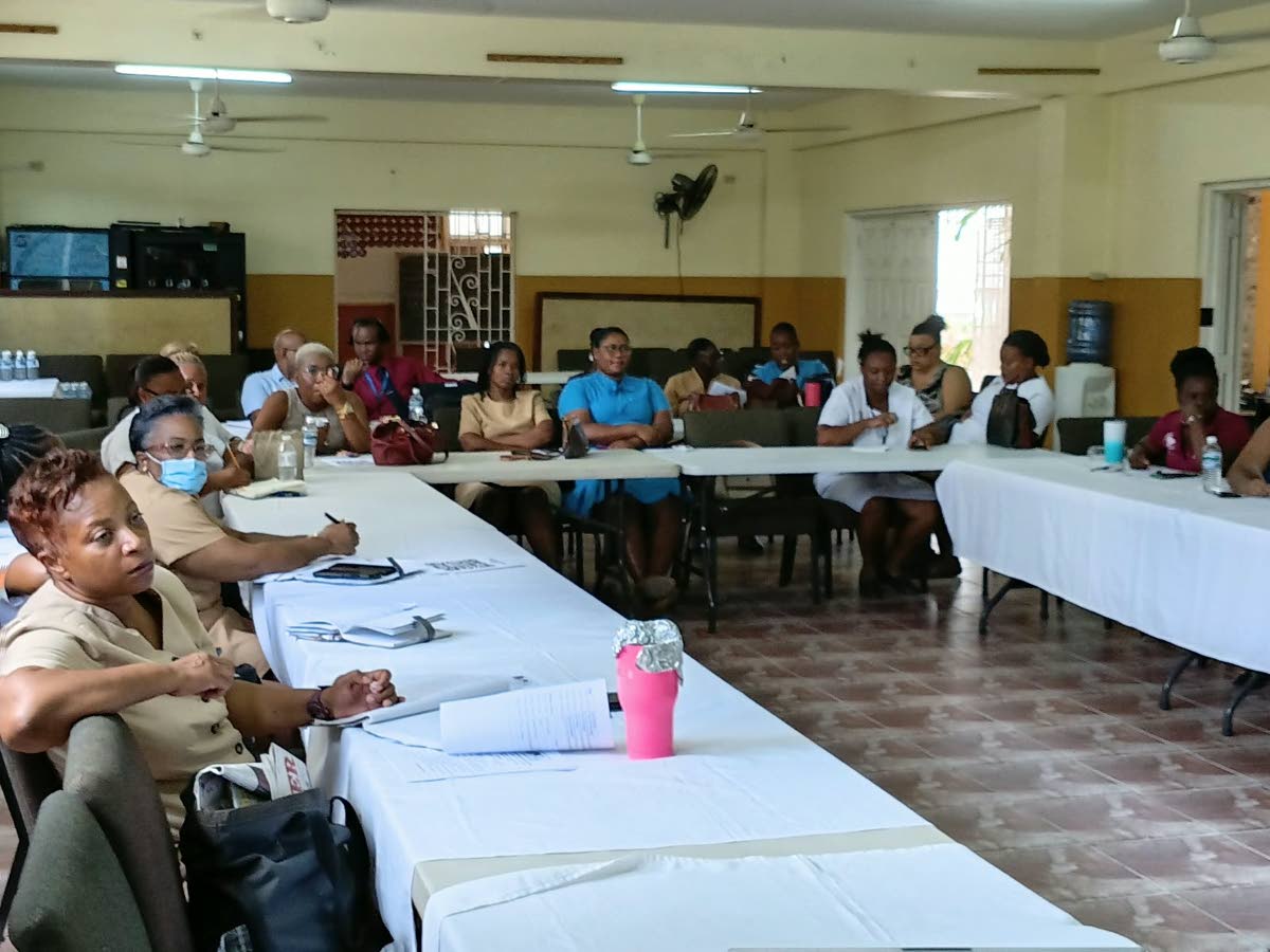 Medical and healthcare practitioners listen keenly to data on mental health during the Western Regional Health Authority’s Family Health Review, held at the Burchell Baptist Church Hall in Montego Bay on August 20. 