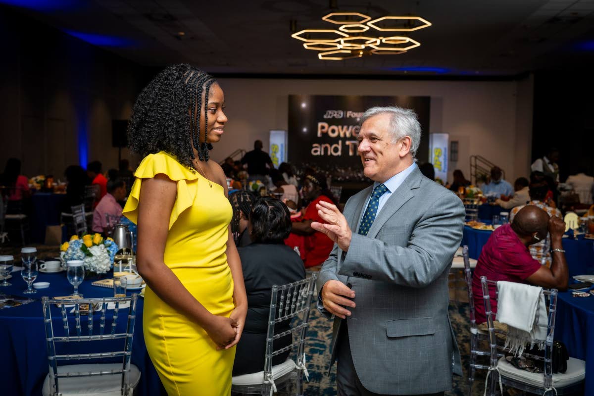 JPS Foundation Chairman Damian Obiglio (right) talks career trajectories with biomedical engineer aspirant, Abrianna Greaves at the Foundation’s awards ceremony.
