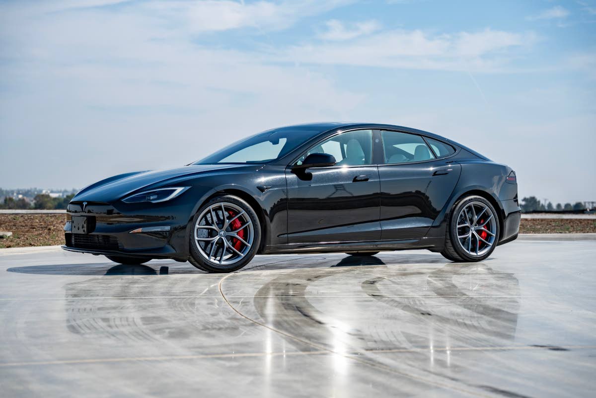 AP 
This photo provided by Tesla shows the Model S, one of the first mass-produced EVs. The base model has all-wheel drive and an EPA-estimated range of 410 miles. 
