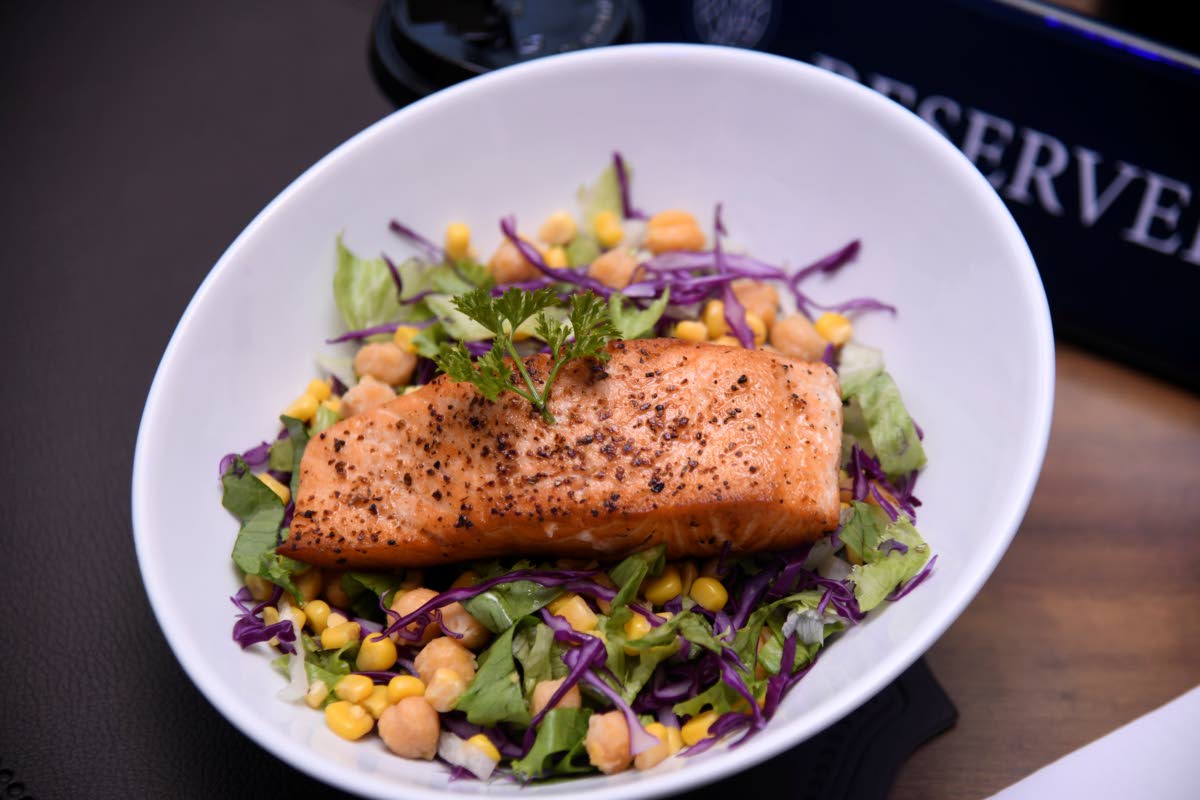 This scrumptious salad, topped with salmon, is available with your choice of protein. 