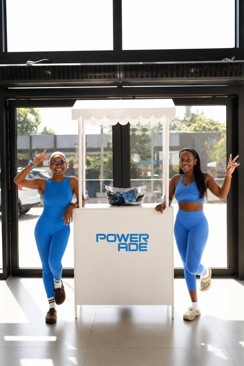 Daneilla McKenzie (left), media practitioner, and Shanelle Johnson, attorney-at-law, make a stylish match in blue.