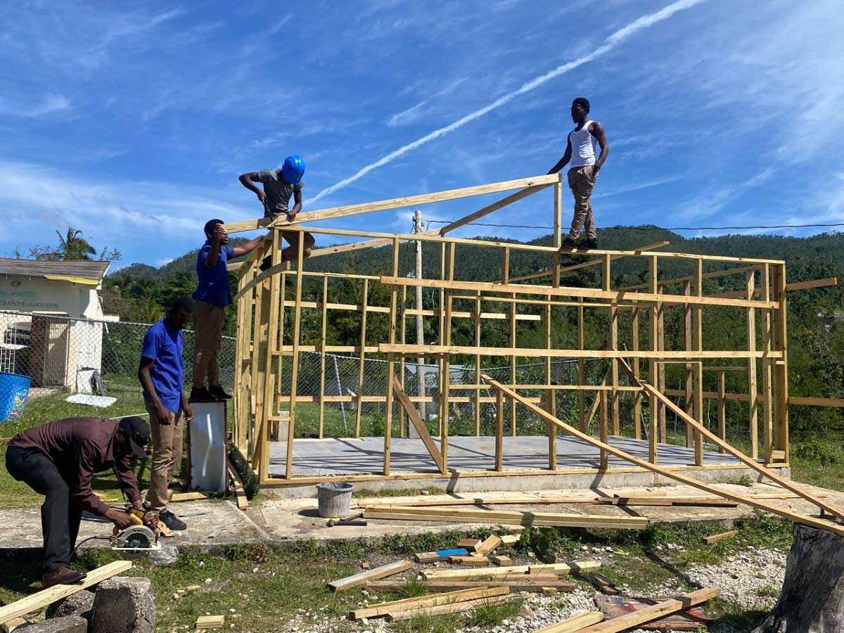 Students and staff at Aberdeen High School in Aberdeen, St Elizabeth, advance reconstruction of the institution’s tuck shop, which was decimated by Hurricane Melissa. 