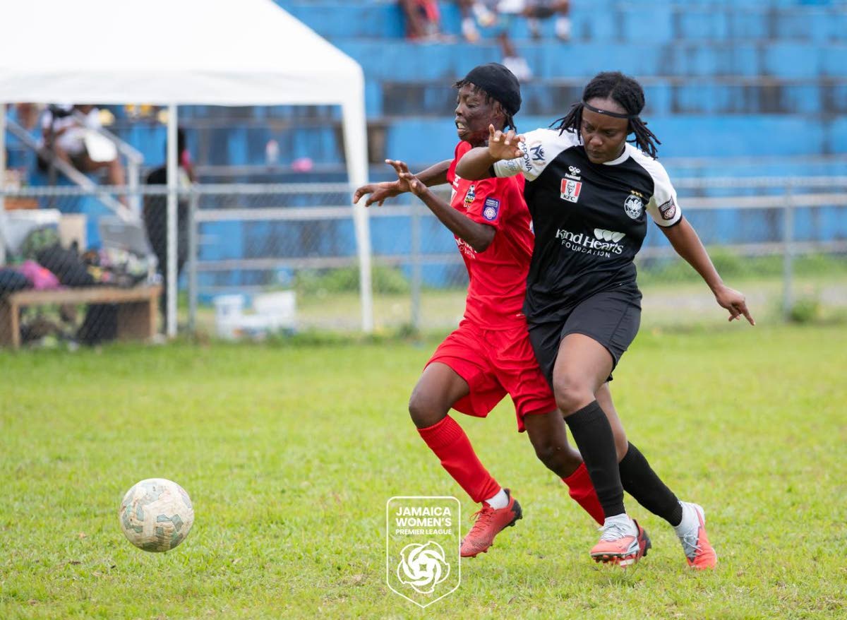 Amoy McKenzie (left) challenges for the ball during a Jamaica Women’s Premier League football match.