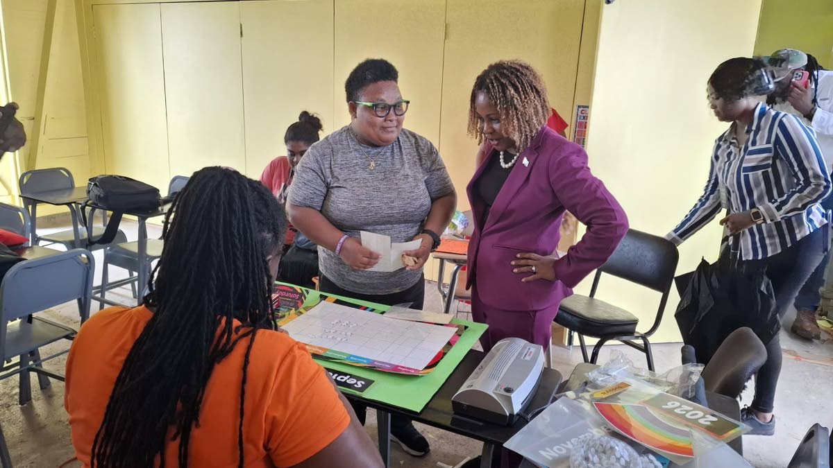 Education Minister Dana Morris Dixon admires the preparatory work being done by the teachers ahead of the new school year.
