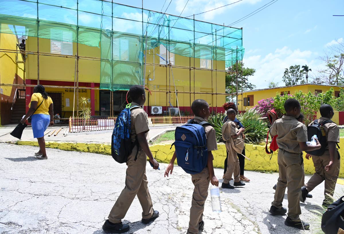 New students are seen walking at a section of Cornwall College’s upper school that is undergoing reconstruction on Monday’s first day of school.