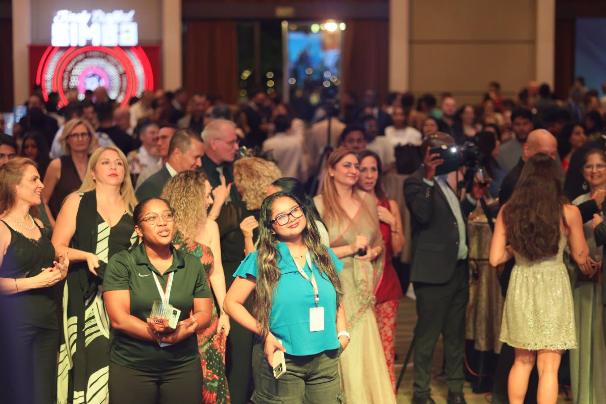 Guests enjoy a performance by singer Hezron at a recent Jamaica Independence celebration gala in New Delhi, India.