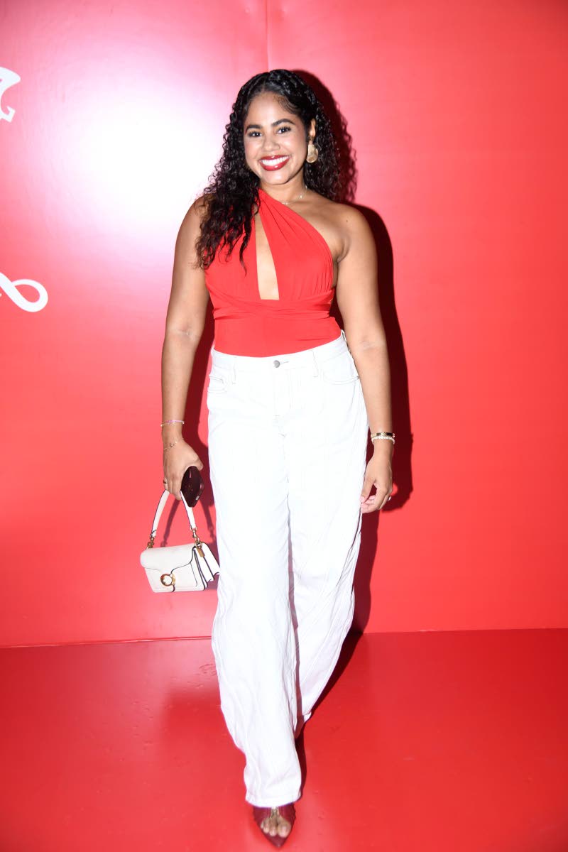 Creative director of TÓIR Limited, Tori Haber, selected an uber chic red asymmetrical one-shoulder top and white wide-leg trousers combo to celebrate the occasion.