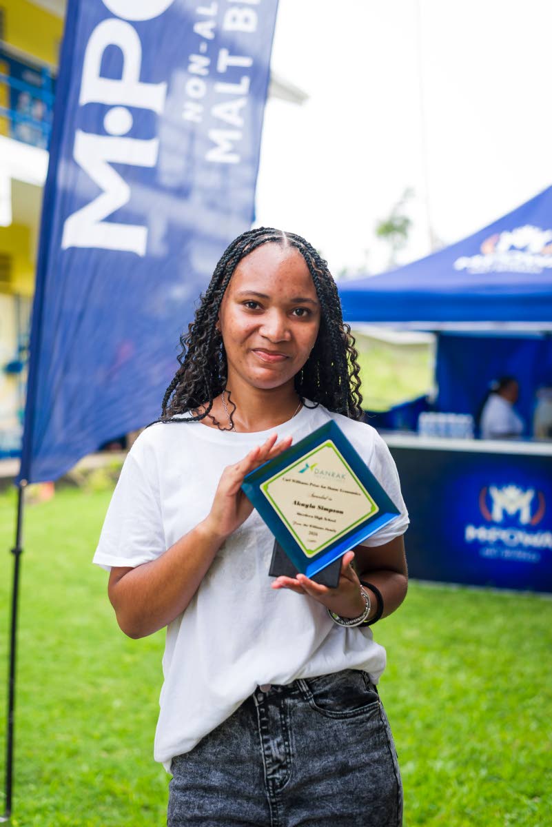 Akayla Simpson shows off her award after receiving the 2026 Carl Williams Prize for Home Economics. Now enrolled at The Mico University College, Simpson is pursuing a Bachelor of Education in Mathematics.