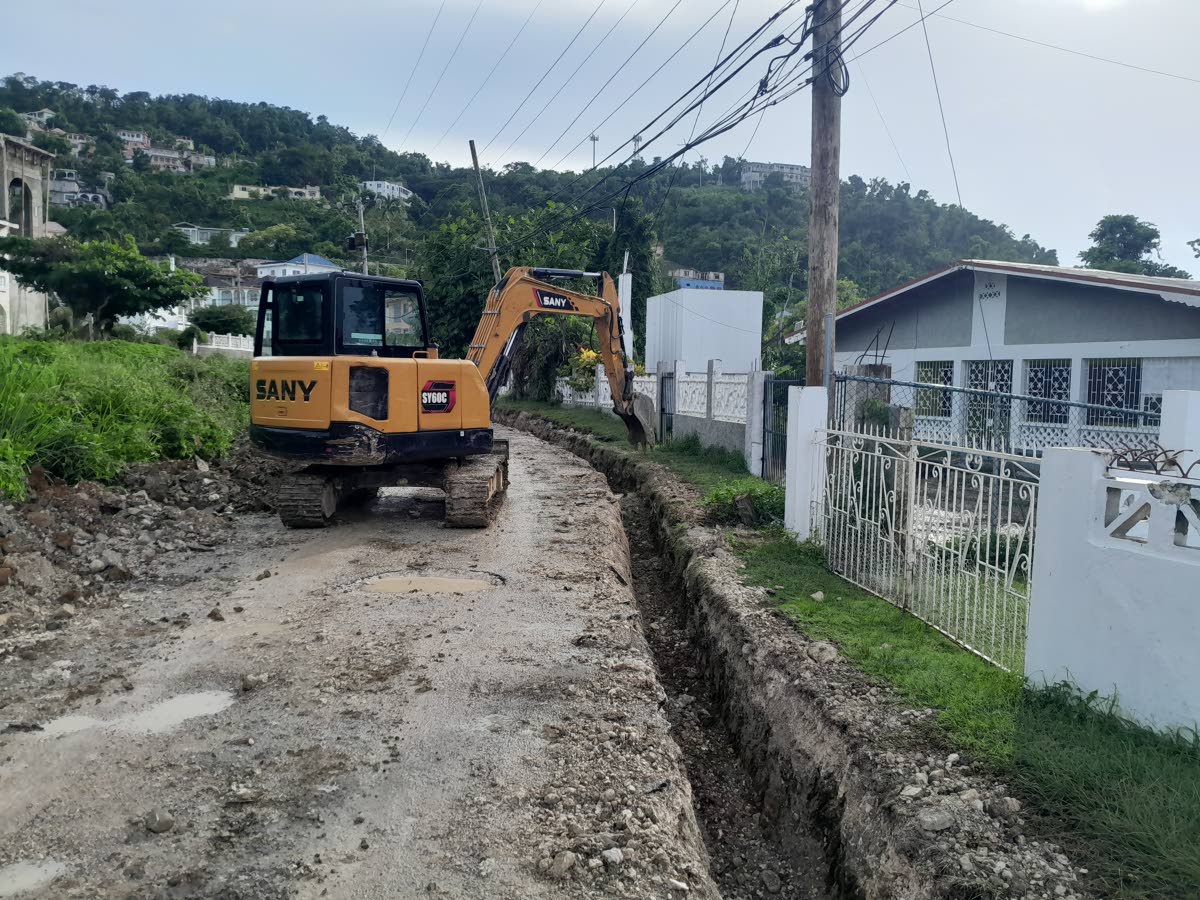 The SPARK work crew refilling a trench they had dug in Pondpiece, Hanover, last Friday.