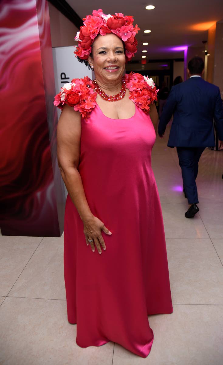 Corah Ann Robertson-Sylvester, president of the Shipping Association of Jamaica, tops her look with an eye-catching headpiece.