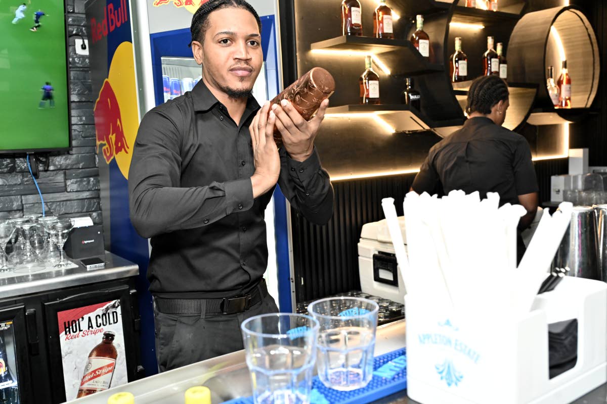 Jennoy Waugh, bartender at EGO restaurant, whips up a strawberry margarita cocktail for a waiting customer.