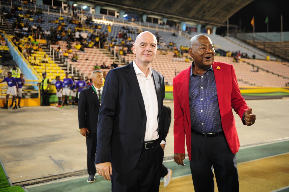 Embattled FIFA president Gianni Infantino (left) with president of the Jamaica Football Federation, Michael Ricketts.