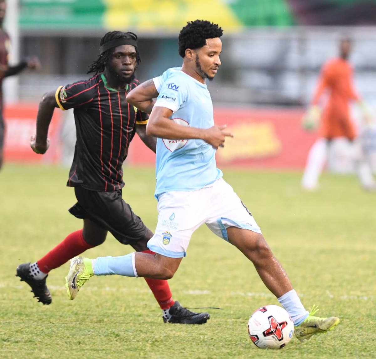 Mario Simms (right) of Waterhouse dribbles away from Tramain Graham of Humble Lion during their Jamaica Premier League match at the Anthony Spaulding Sports Complex in Kingston on September 21. Waterhouse won 5-0.