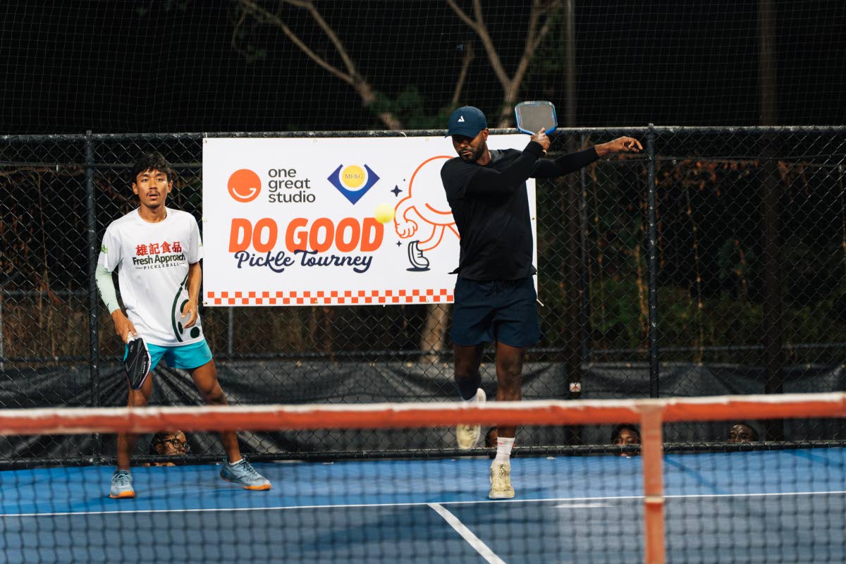 Fresh Approach’s Kobi Stiebel (right) drives the ball across the net as teammate Maung Khant (left) stays ready behind him. The ‘Gyal Dem Instant Noodles’ duo finished as Class A runners-up at the Do Good Pickleball Tourney.