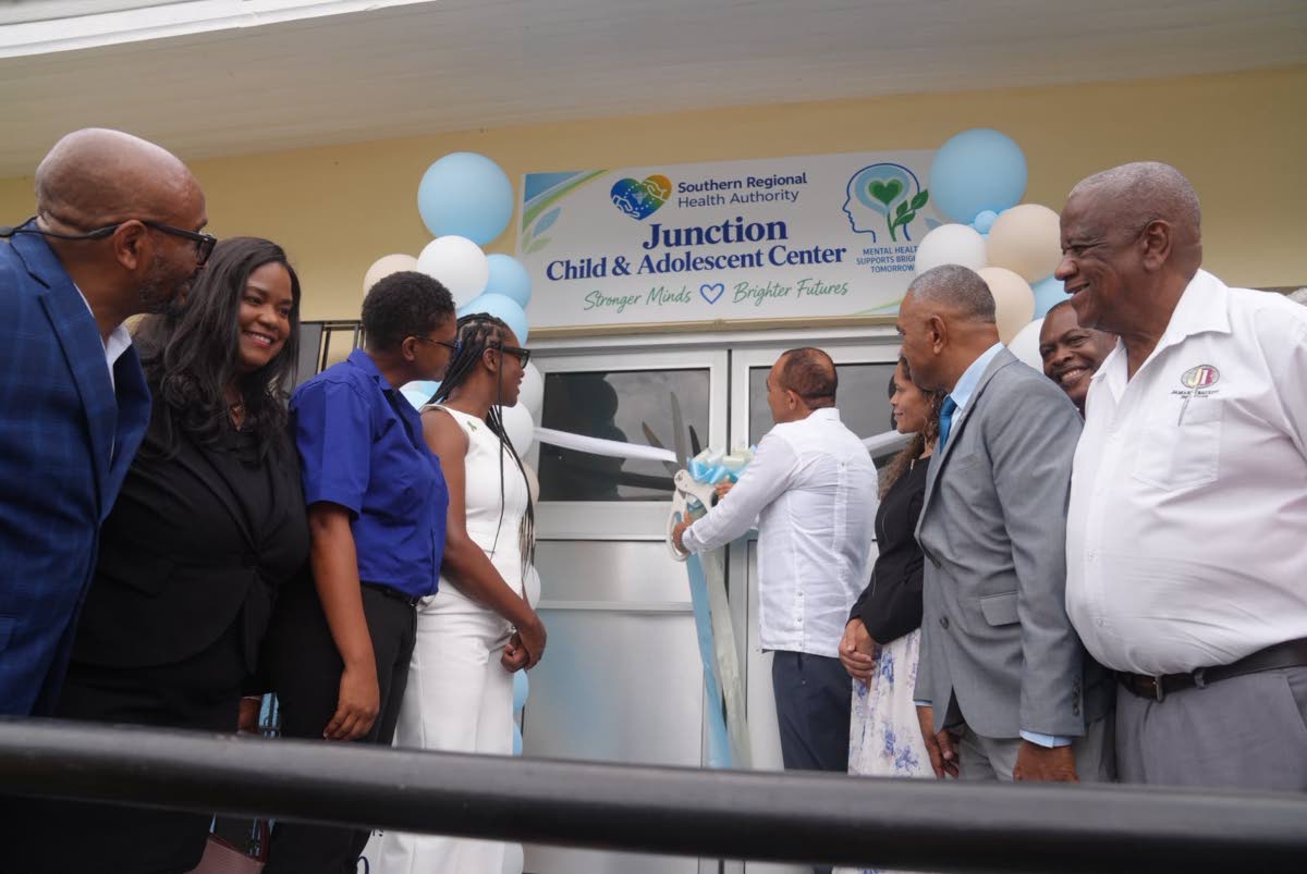 Health and Wellness Minister Dr Christopher Tufton (centre) cuts the ribbon to open the Child and Adolescent Health Centre at the Junction Health Centre in St Elizabeth on Thursday. Sharing in the occasion (from left) are Sean Brissett, parish manager for 