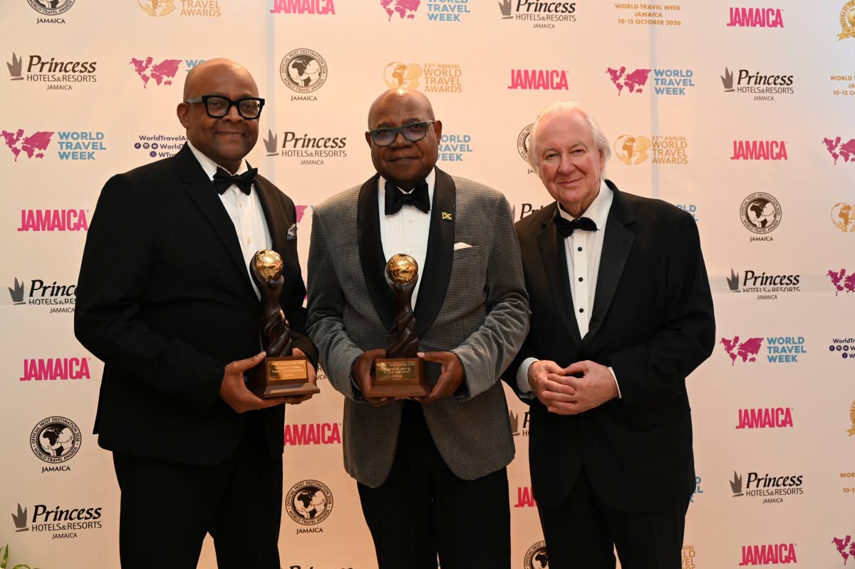 Jamaica's Minister of Tourism, Edmund Bartlett (centre), and the country's Director of Tourism, Donovan White (left), pose with the founder of the World Travel Awards, Graham Cooke, during the 33rd Annual event at the Princess Grand Hotel in Hanover on Sun