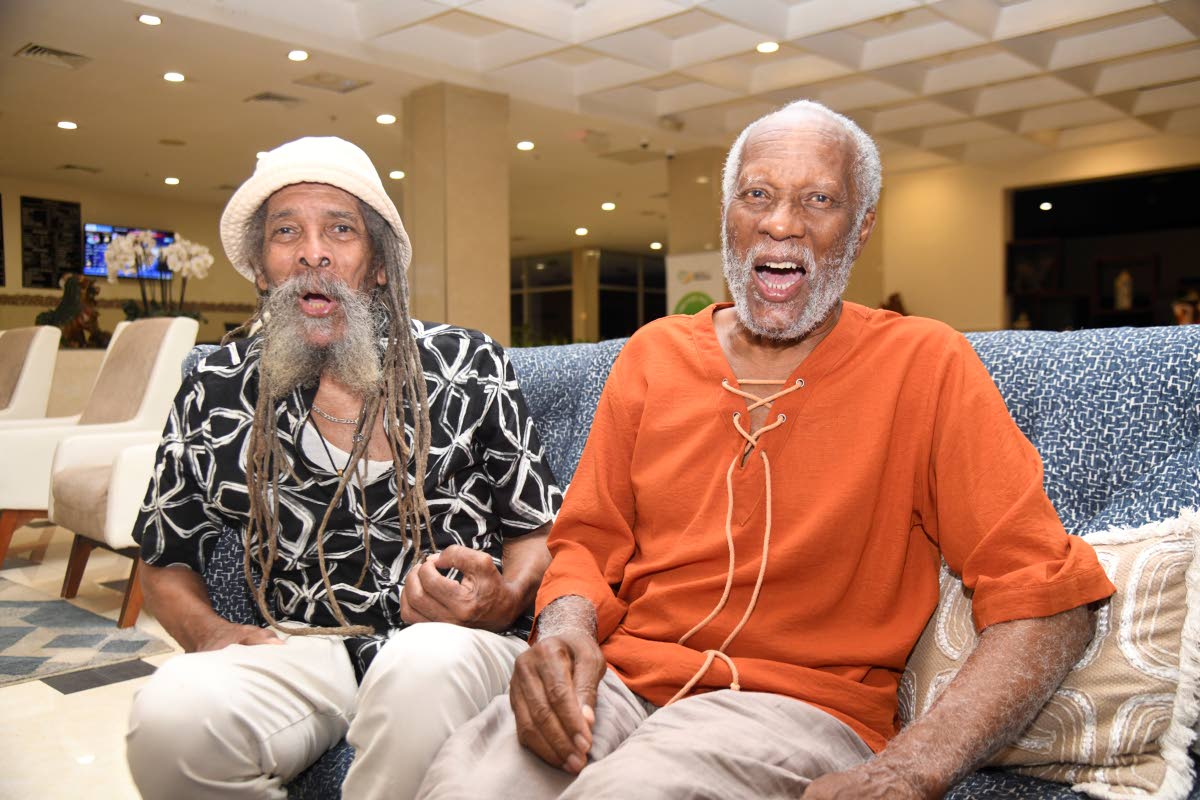 Photos by Antoine Lodge/Photographer 
Master conga player and percussionist Larry McDonald (left) and Herbie Miller, director and curator of the Jamaica Music Museum, share a laugh on Thursday night at The Jamaica Pegasus hotel in New Kingston. 