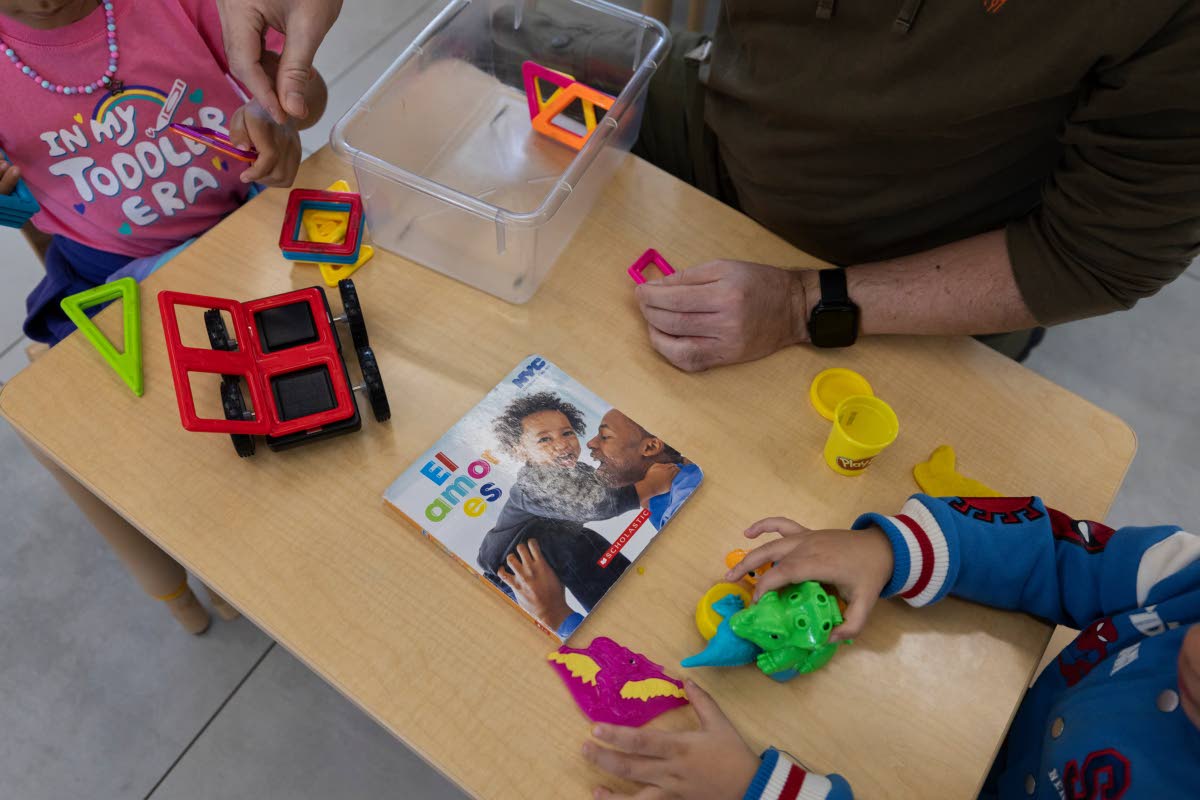 A teacher and children play with magnetic building tiles and modeling clay at the John Cardinal O’Connor Center for Parent and Child Development, a Head Start centre in San Juan, Puerto Rico, last Tuesday.