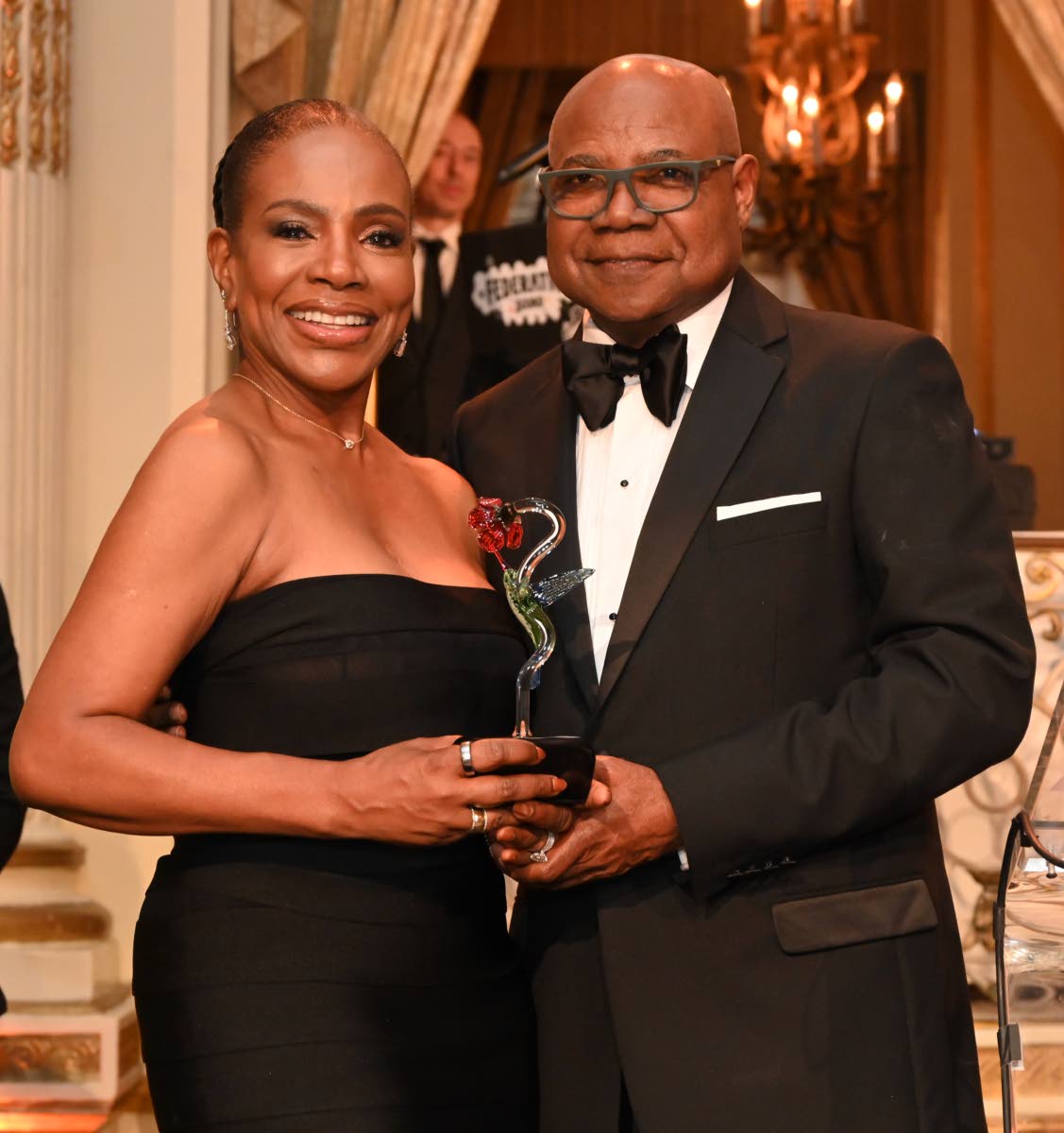 Emmy Award winner Jamaican-American actress Sheryl Lee Ralph accepts the International Humanitarian Award from Tourism Minister Edmund Bartlett at the American Friends of Jamaica’s Hummingbird Gala last Friday.