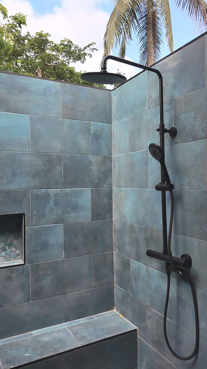 Bathrooms include open-air rainfall showers. 