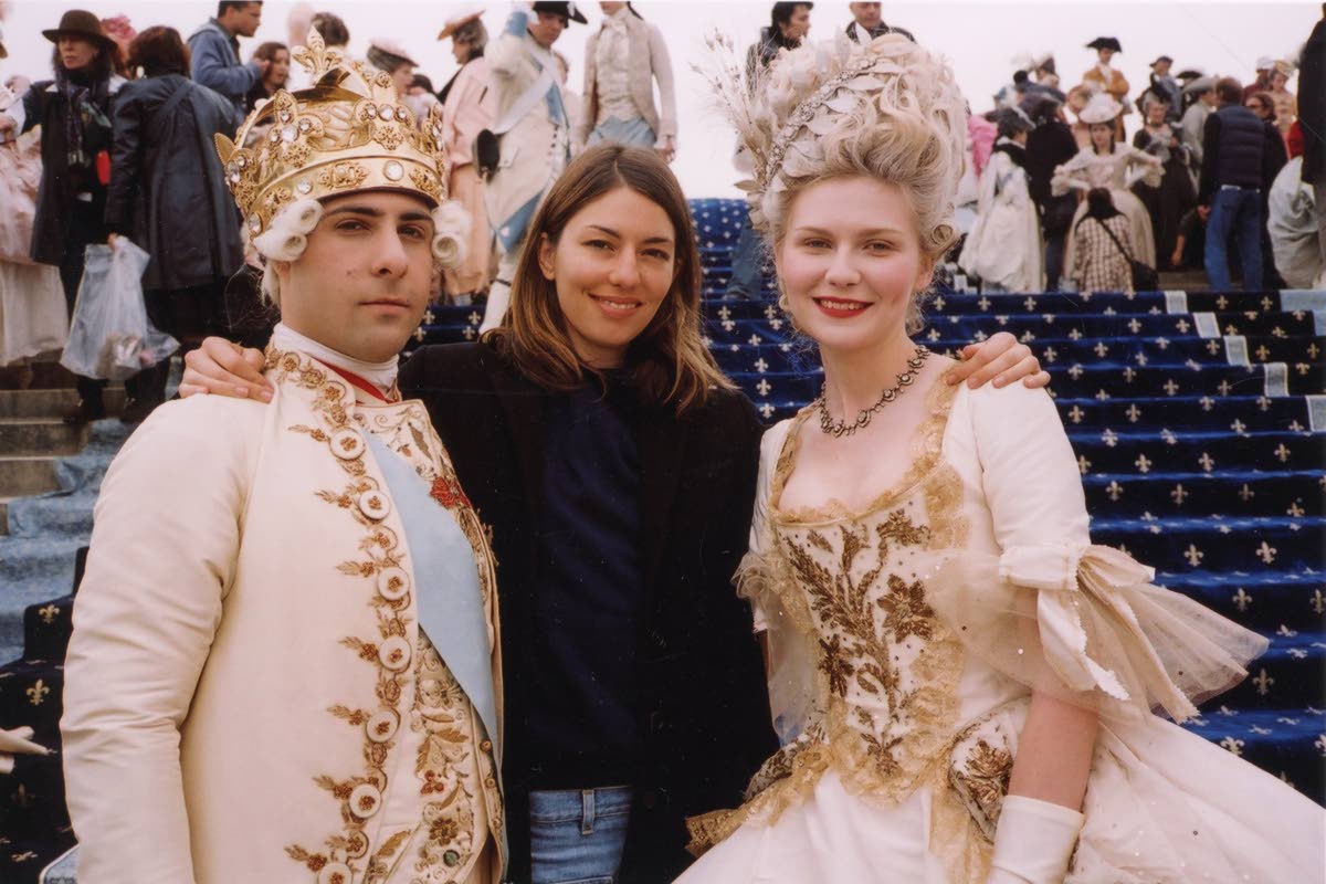 This image released by MUBI shows Sofia Coppola (centre) with cast members Jason Schwartzman (left) and Kirsten Dunst on the set of ‘Marie Antoinette’.