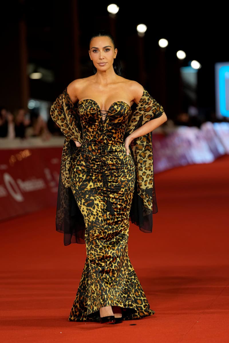Kim Kardashian steps out in an archival Yves Saint Laurent creation, a 1986 leopard-print corset gown with a strapless, lace-up bodice and mermaid skirt. Styled by Law Roach, the vintage look brings a touch of fashion history to the Rome Film Festival red 