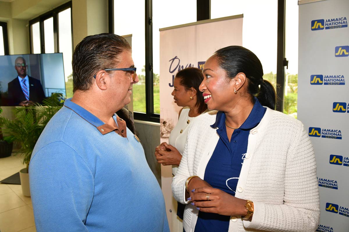 Custos of St Ann Joseph Issa explains to Luwanna Williams, managing director, JN Bank,about the many opportunities for investment in the parish during a recent stakeholder breakfast meeting organised and hosted by The Jamaica National Group as part of its 