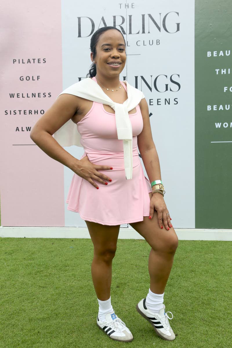 Brittney Thompson, owner and operator of Bougee Boulevard, brings a preppy touch to the afternoon in a blush-pink number, paired with a white sweater draped over her shoulders.