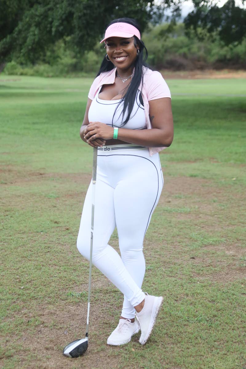 Catyana Locke, supervisor at Maison Chic, gives sporty style a polished finish in a white ALO two-piece set, paired with a pink visor.