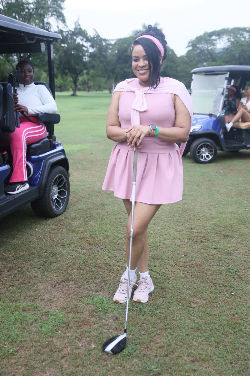Marketer Cresanna Russell is all smiles, embracing the occasion in blush-pink.
